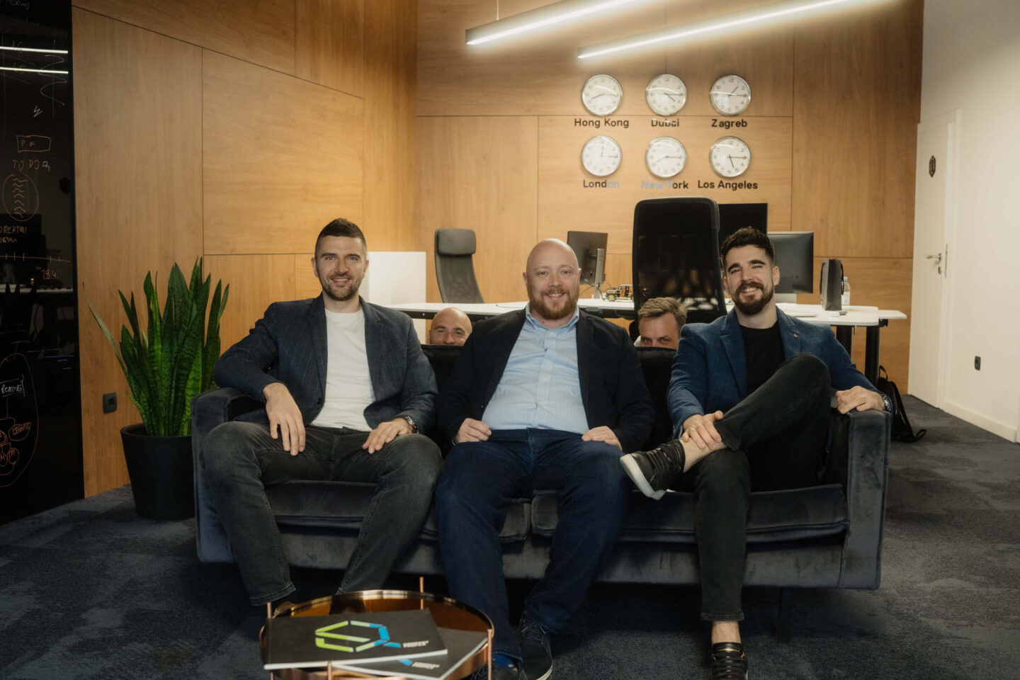 Q's Management members along with Chairman and Co-Chairman