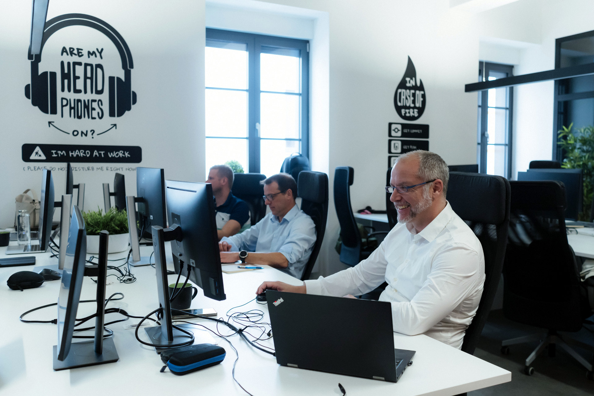 Nearshore software developers working at a software agency.