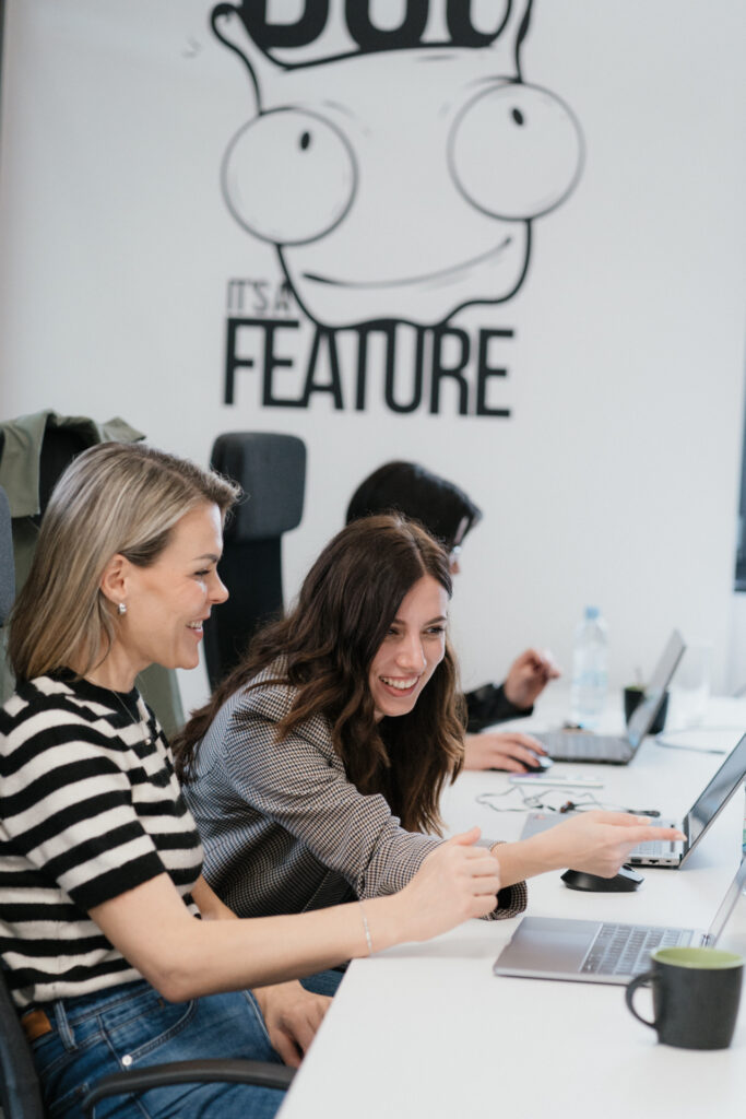 Q team working together at their desk.