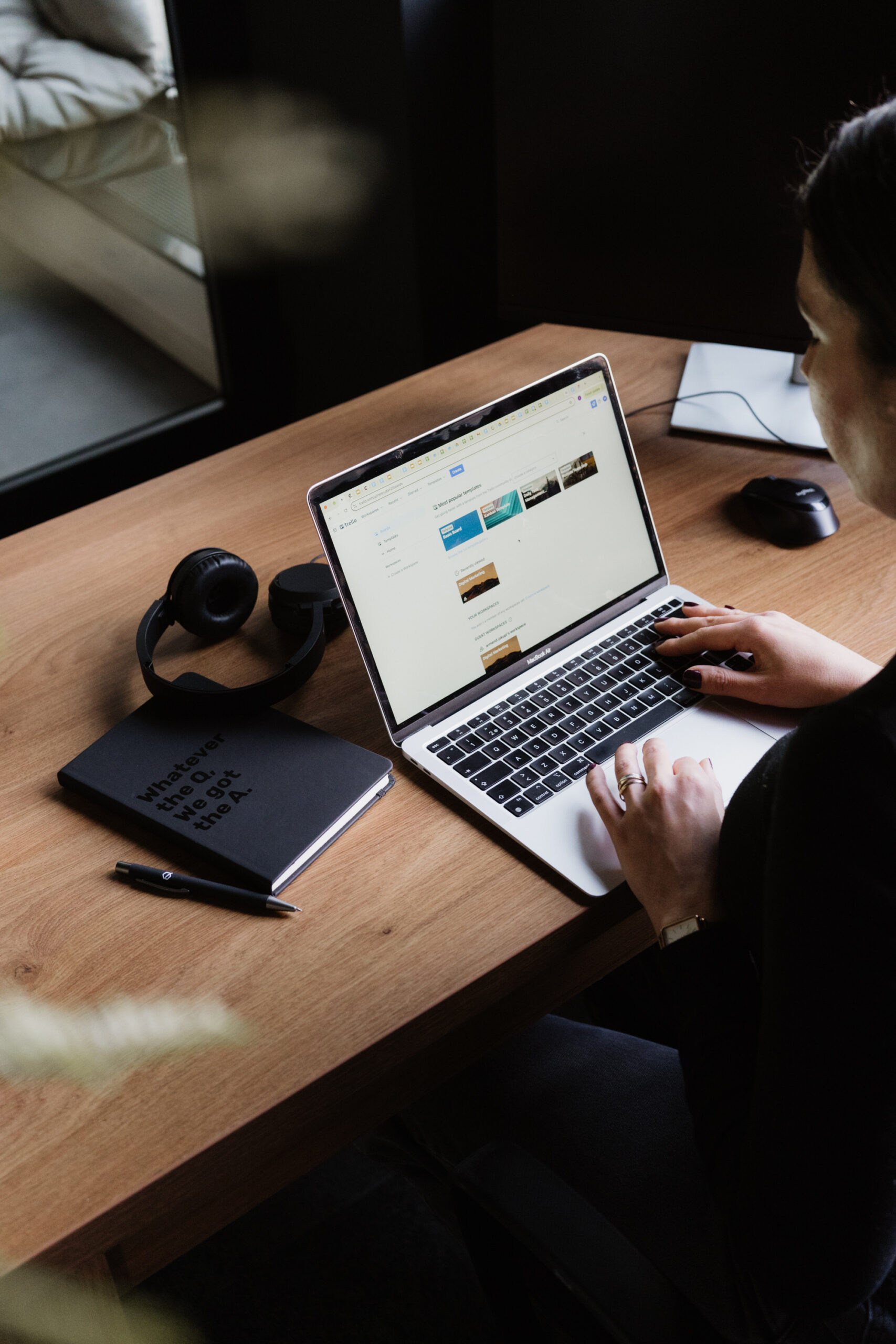 Image showing a Q teammate working at their desk.