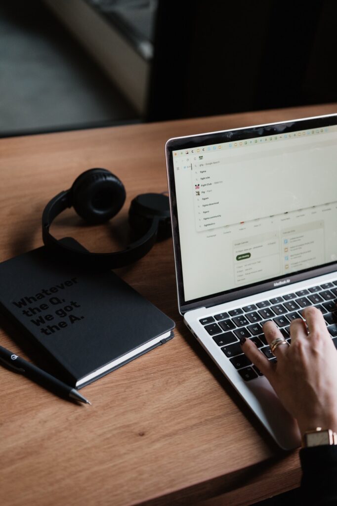 Image showing a desktop and a laptop with a notebook.