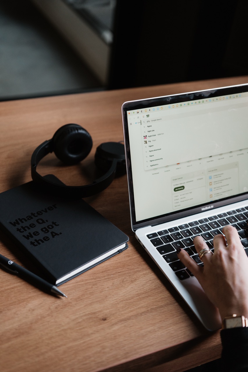 Image showing a desktop and a laptop with a notebook.